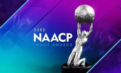 the NAACP image award, which is a silver statue of a man kneeling and holding up the world